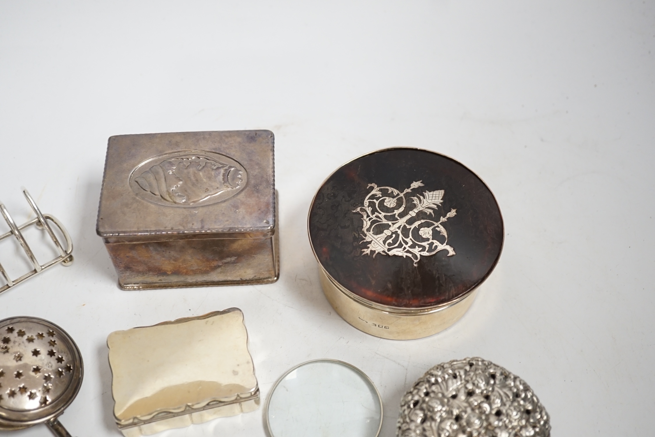 Sundry small silver and white metal including a George IV Old English pattern sifter spoon, later heart shaped five bar toast rack, seven assorted boxes, a vets case and twenty two other items.